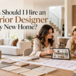 Interior designer discussing home interior plans, material samples, and design ideas with homeowners in a modern living room.